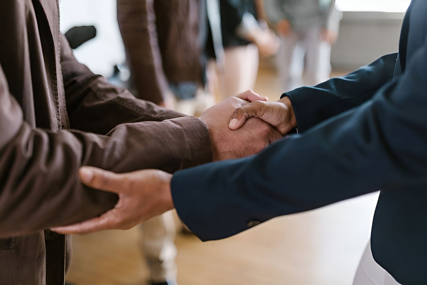 Central Coast accountants from Tenth Avenue Accountants & Financial Advisors shaking hands with a client in Toukley, NSW.