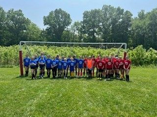 Youth soccer team posing after All Star Game