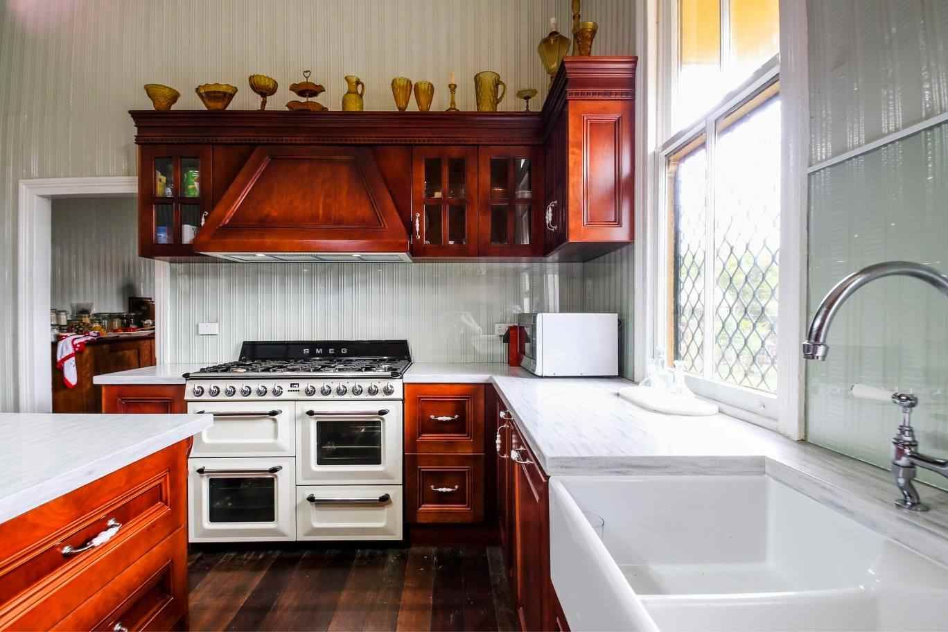 A Old Vintage like Kitchen with Dark Oak and Oven — Crispin Cabinetmakers in Woolgoolga, NSW