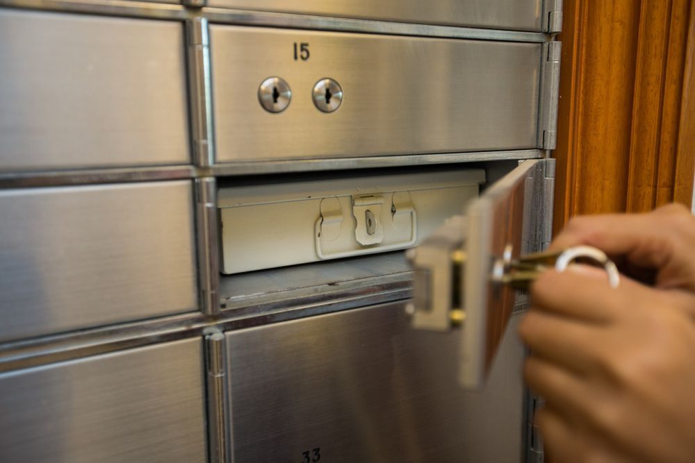 A Person is Opening a Safe With a Key — Darwin Lock & Key In Palmerston, NT