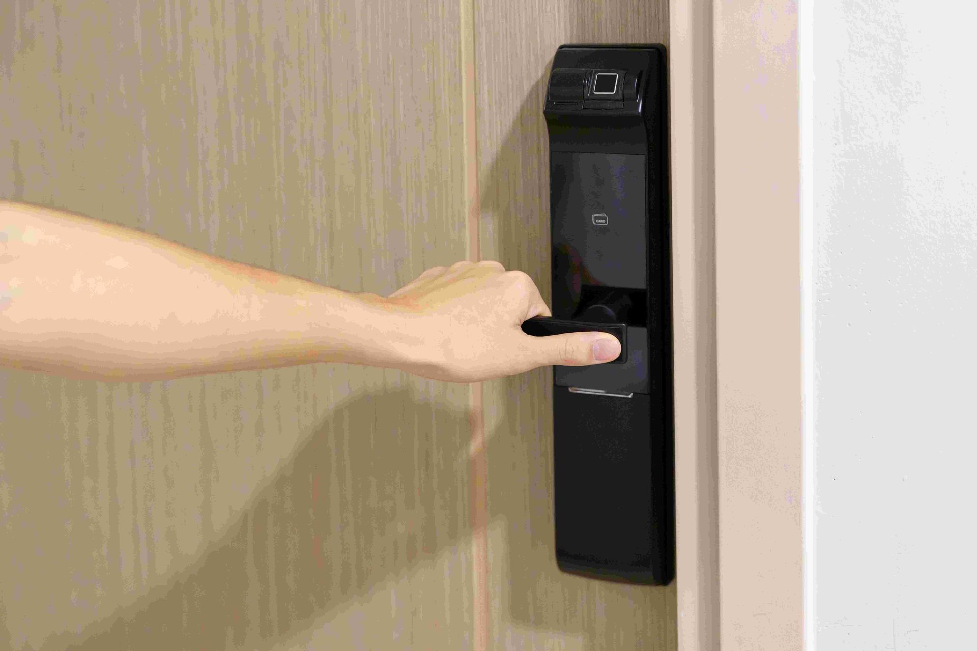 A Person is Opening a Door With a Fingerprint Lock — Darwin Lock & Key In Rural Darwin, NT