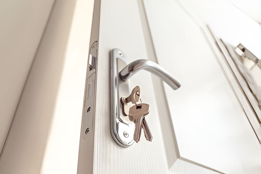 A Close Up of a Door With Two Keys in It — Darwin Lock & Key In Coconut Grove, NT