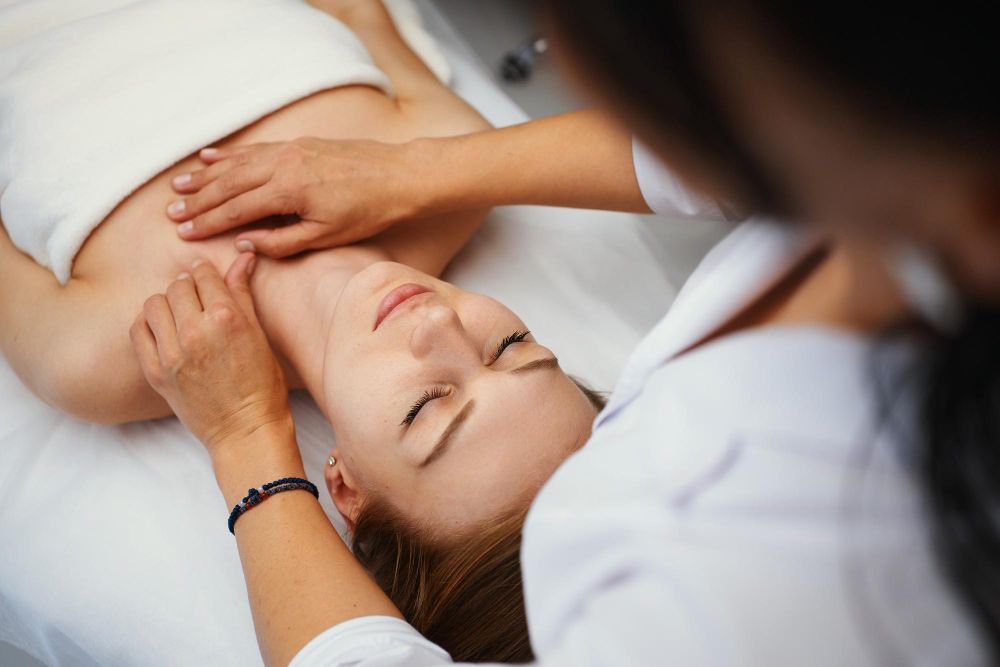 A woman is getting a lymphatic massage at a spa.