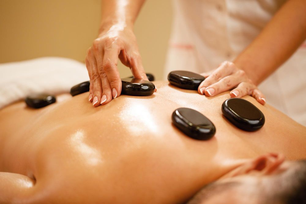 Teaching massage therapists how to do hot stone massage