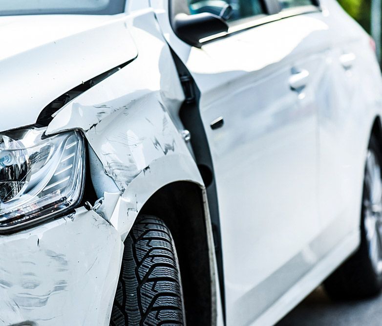 A White Car with Multiple Damaged Side Panels — Westside Panels & Towing in Prospect Vale, TAS