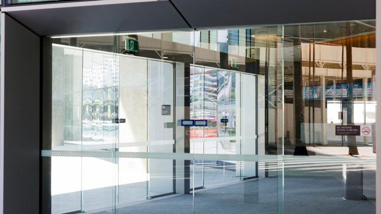 Office Building Glass Sliding Door — Myrtle Beach, SC — Superior Doors and Gates Service
