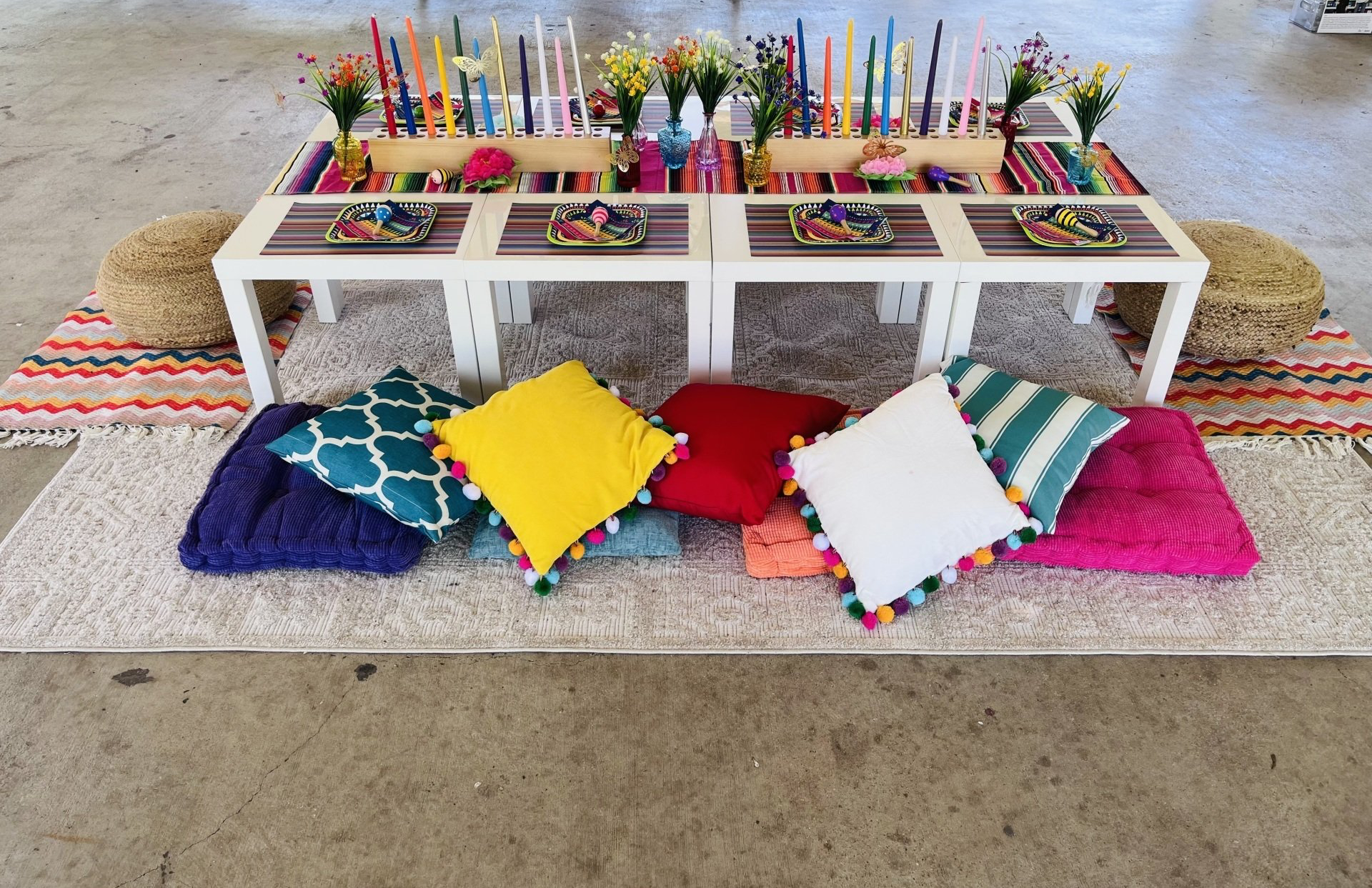 A table with a bunch of pillows on it