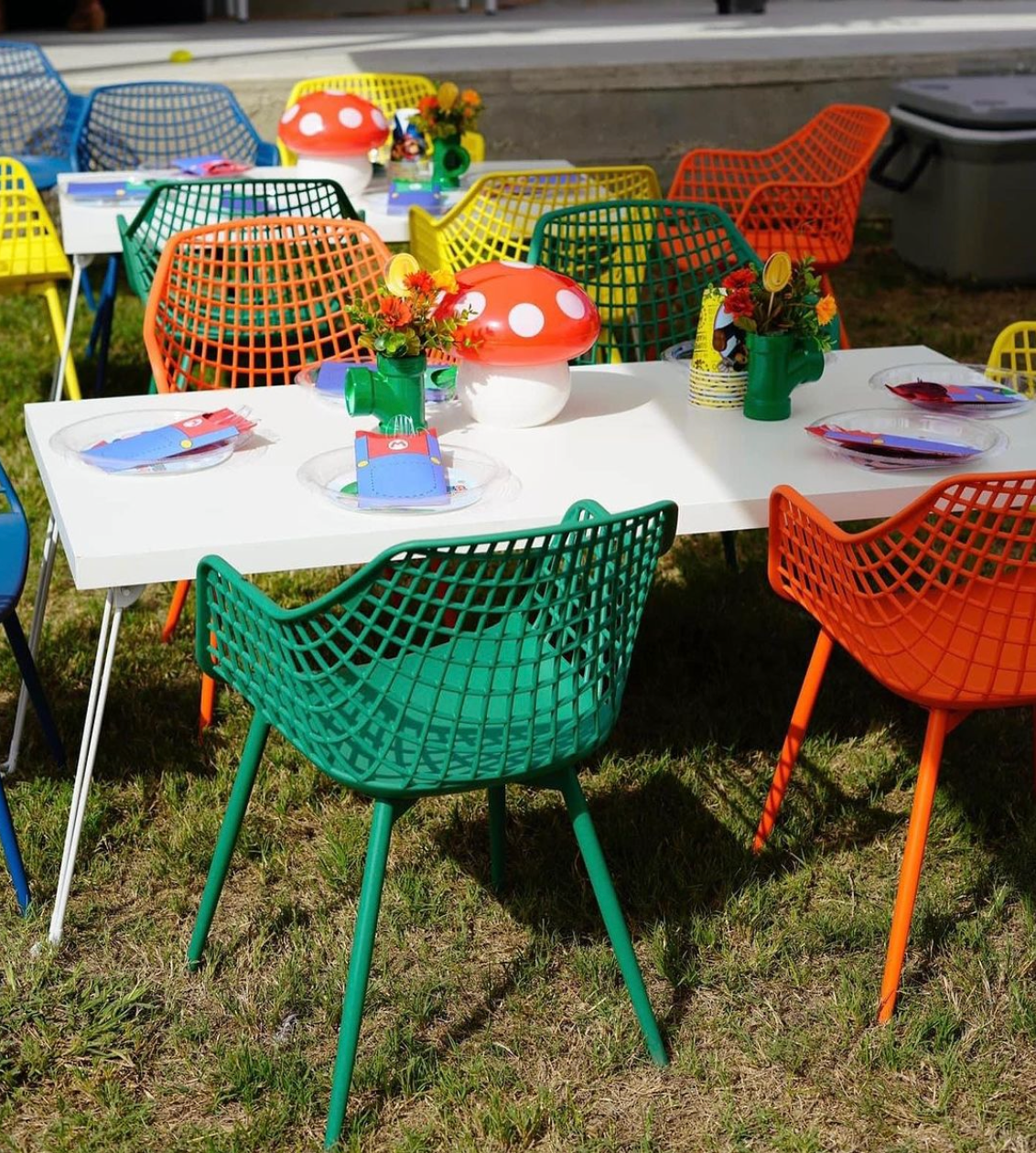 Colorful chairs and tables with mushrooms and flowers on them