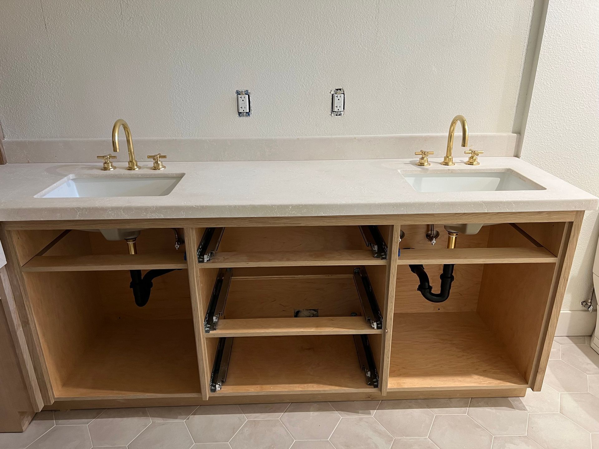 a bathroom vanity with two sinks underneath it