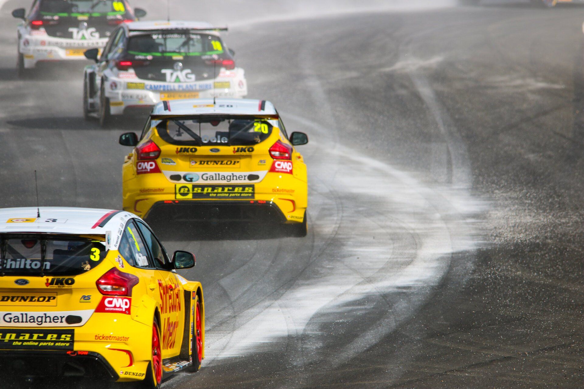 A yellow race car with the word clip on the back