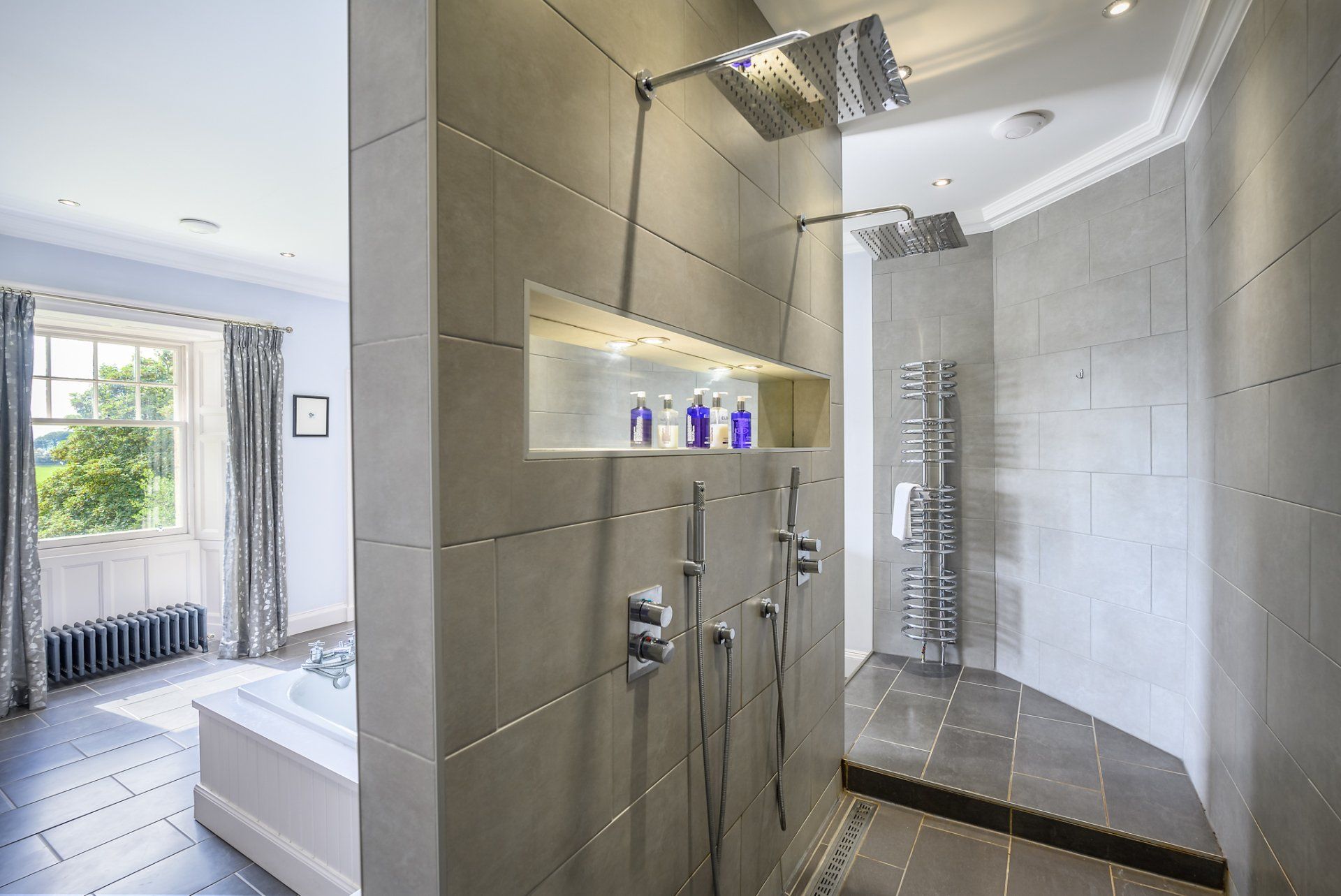 A bathroom with a walk in shower and a bathtub