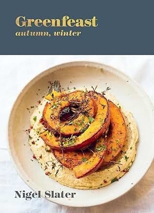Book cover of Greenfeast: Autumn, Winter by Nigel Slater, showing a plated roasted squash dish.