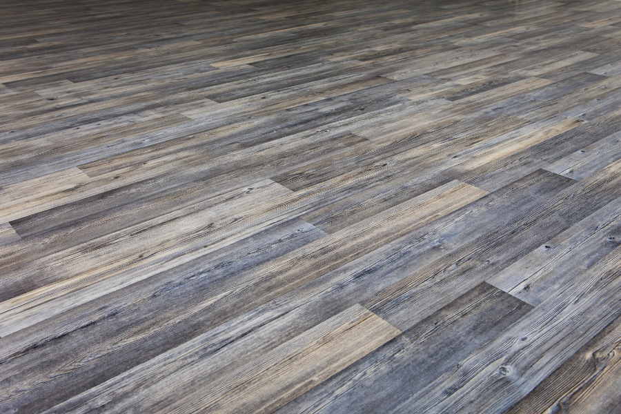 A close up of a wooden floor in a room.