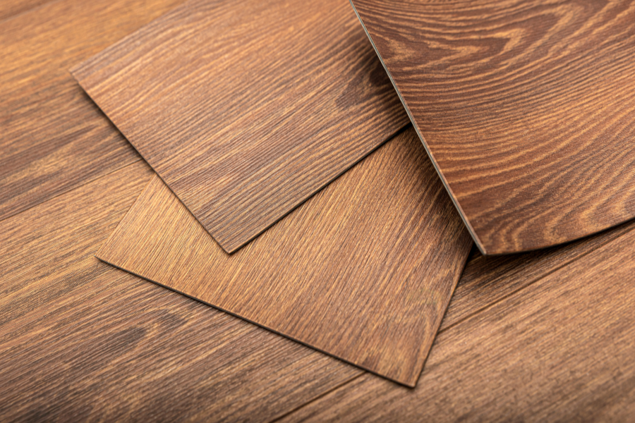 planks of vinyl flooring layered on top on one another