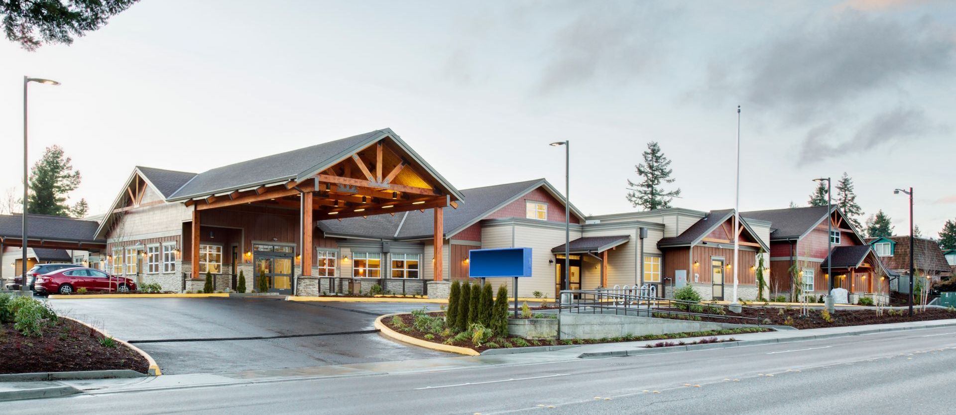 A large building with a parking lot in front of it
