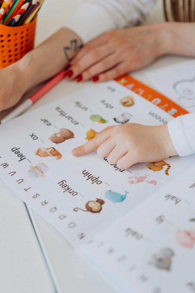 A child is learning how to write the letters of the alphabet.