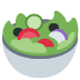 Bowl of salad: green lettuce, tomato, cucumber, black olives, purple onion.
