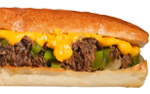 Cheesesteak sandwich with melted yellow cheese, cooked meat, and green peppers on a long roll.