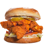 Fried chicken sandwich with pickles, lettuce, and sauce on a bun.