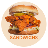 A sandwich with fried chicken, pickles, and sauce on a bun. Text