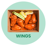 Chicken wings in a cardboard box, with celery and lemon slices.