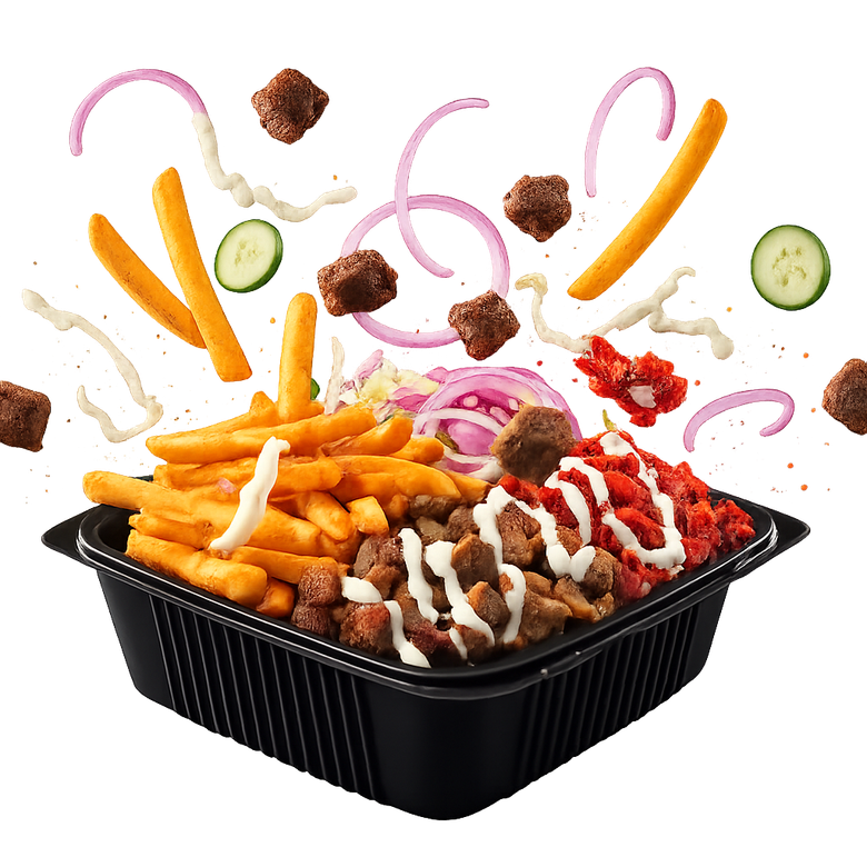 Chicken and fries dish with salad, drizzled with white sauce.