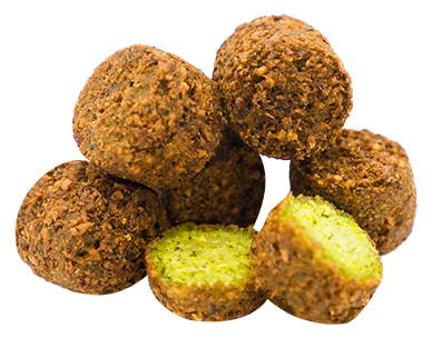 Pile of golden-brown falafel balls, one cut open to show a bright green interior.