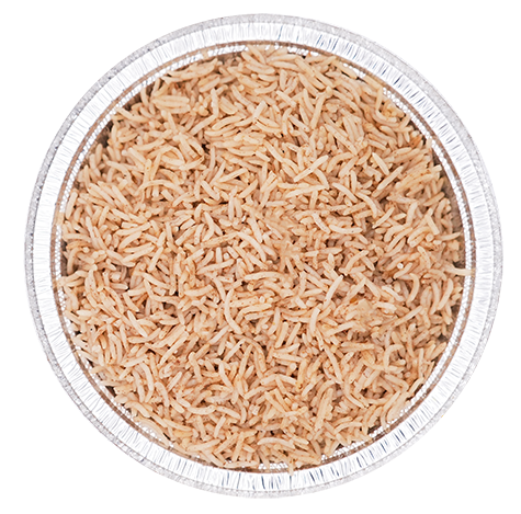 Cooked brown rice in a round foil container.