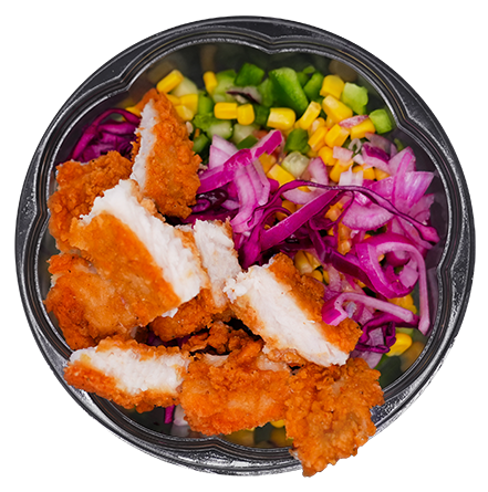 Chicken tender salad bowl with corn, red cabbage, and green peppers.