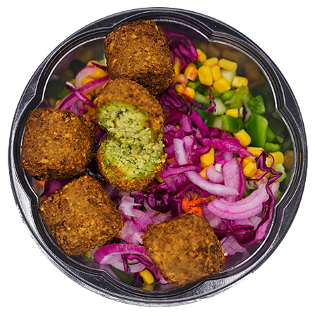 Falafel and salad bowl with red cabbage, corn, and red onion.