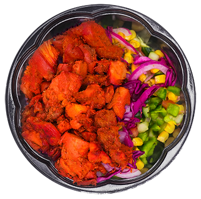 Chicken bowl with red chicken, corn, purple onion, cabbage, and green peppers.