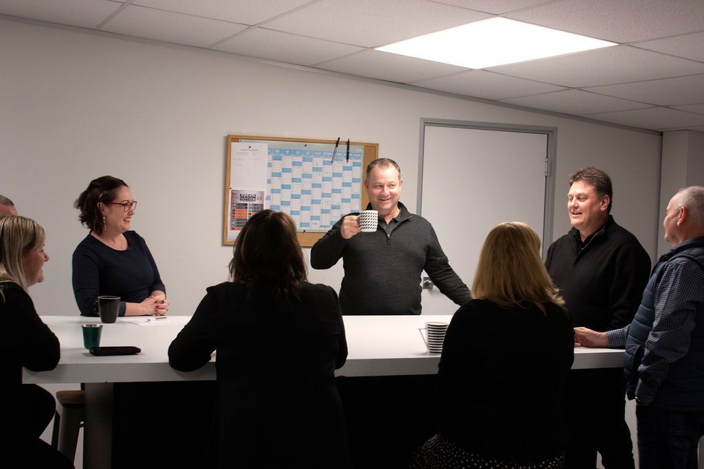 Black & White accounting team discussing business advisory