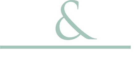 A green ampersand is on a white background.