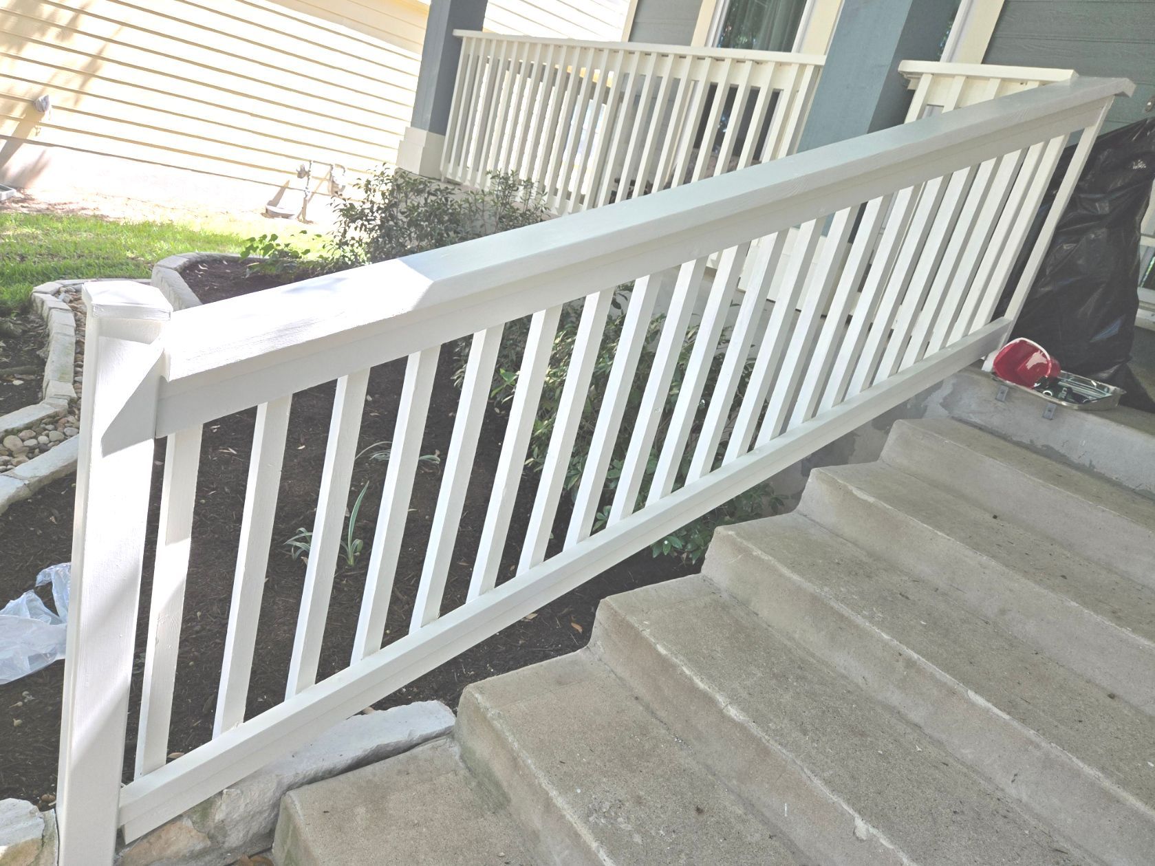a cleaned white banister