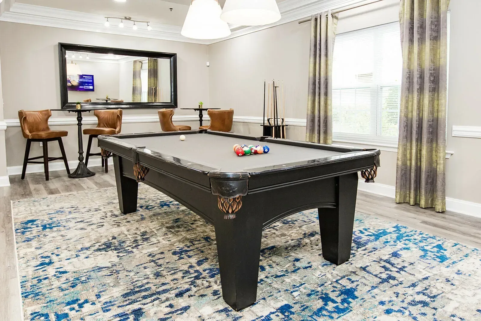 Riverscape at Piney Orchard entertainment lounge with billiard table.