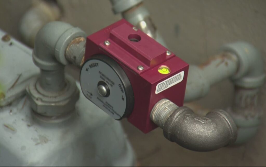 Ted & Bros Plumbing | red pipe with a sticker on it that says ' a ' on it
