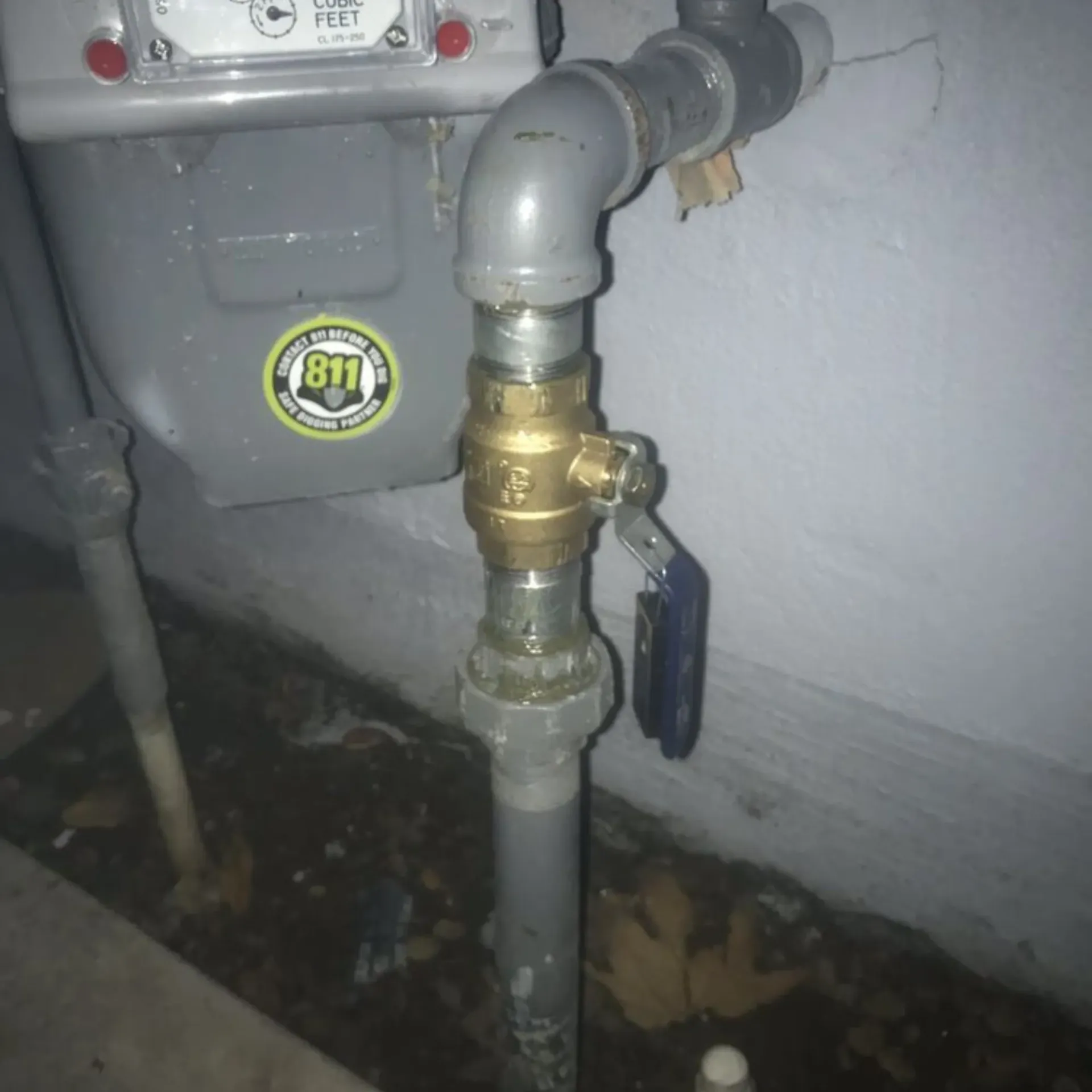 Ted & Bros Plumbing | pipe with a sticker that says 811 on it