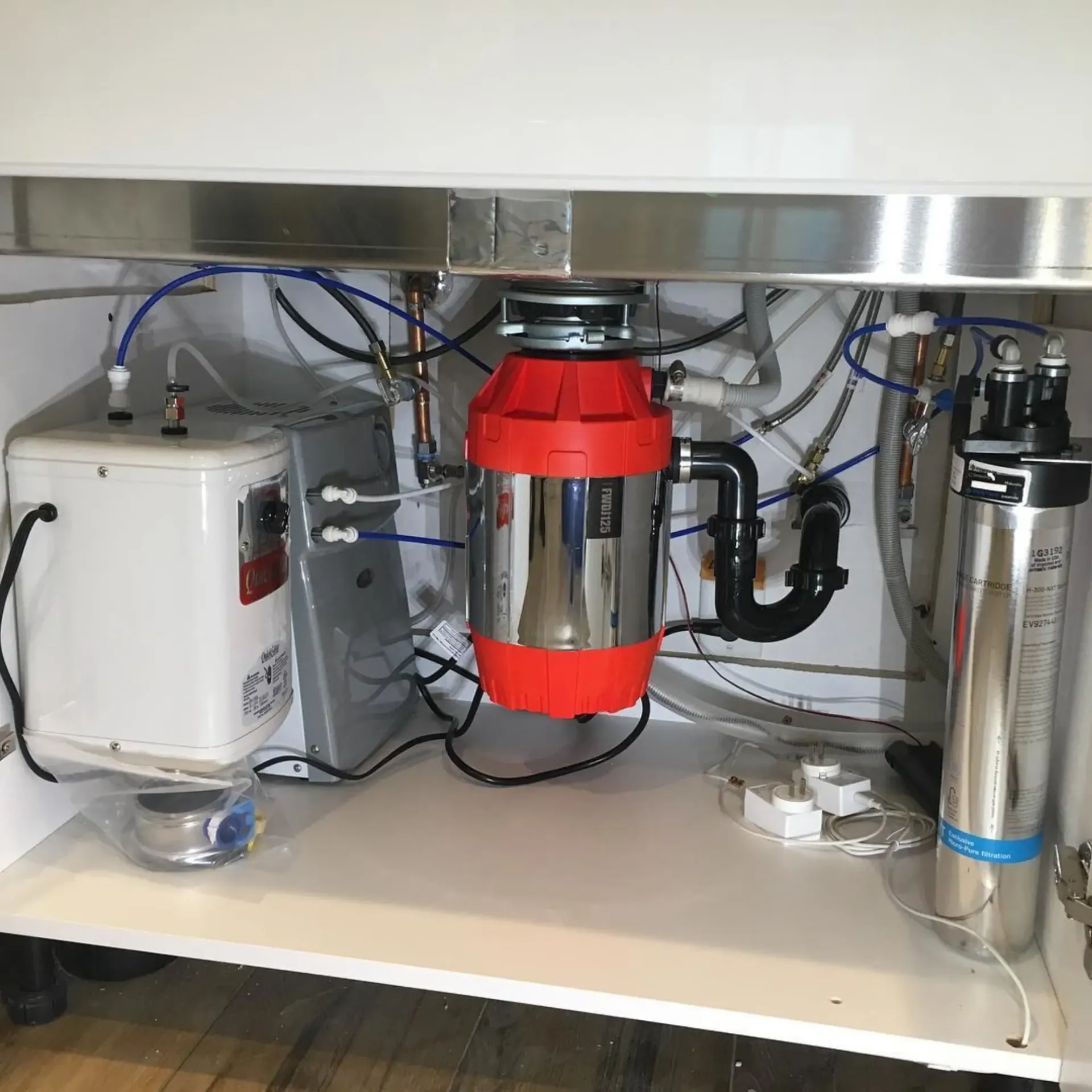 Ted & Bros Plumbing | The underside of a kitchen sink