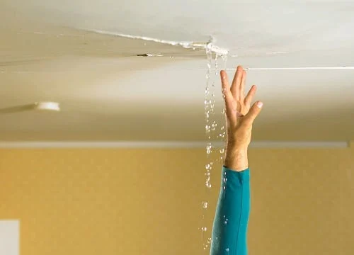 Ted & Bros Plumbing | rusty pipe with water coming out of it