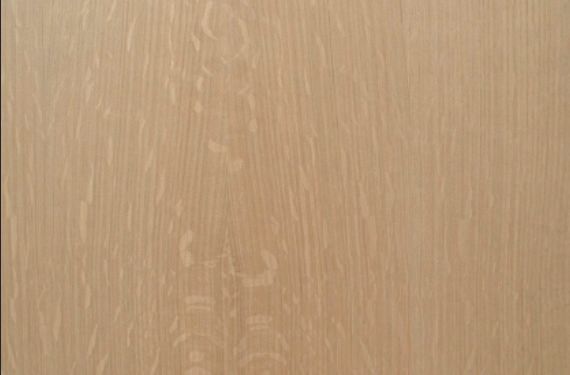 A close up of a piece of wood with a grainy texture.