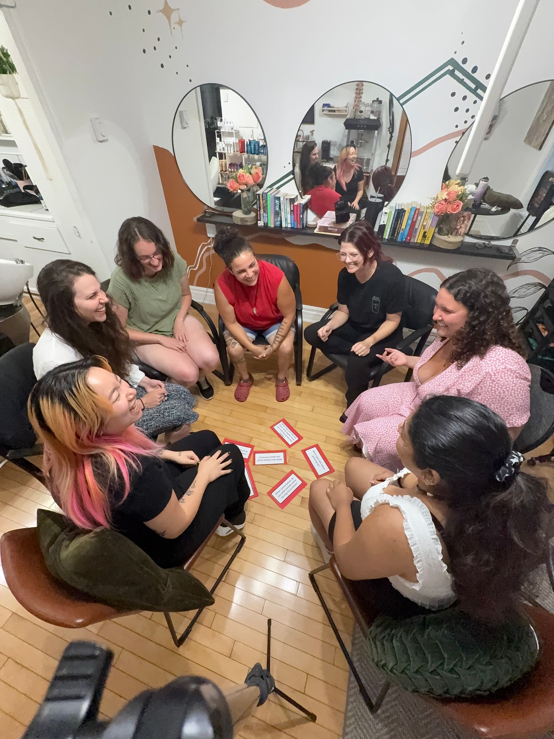Women sitting in circle and laughing
