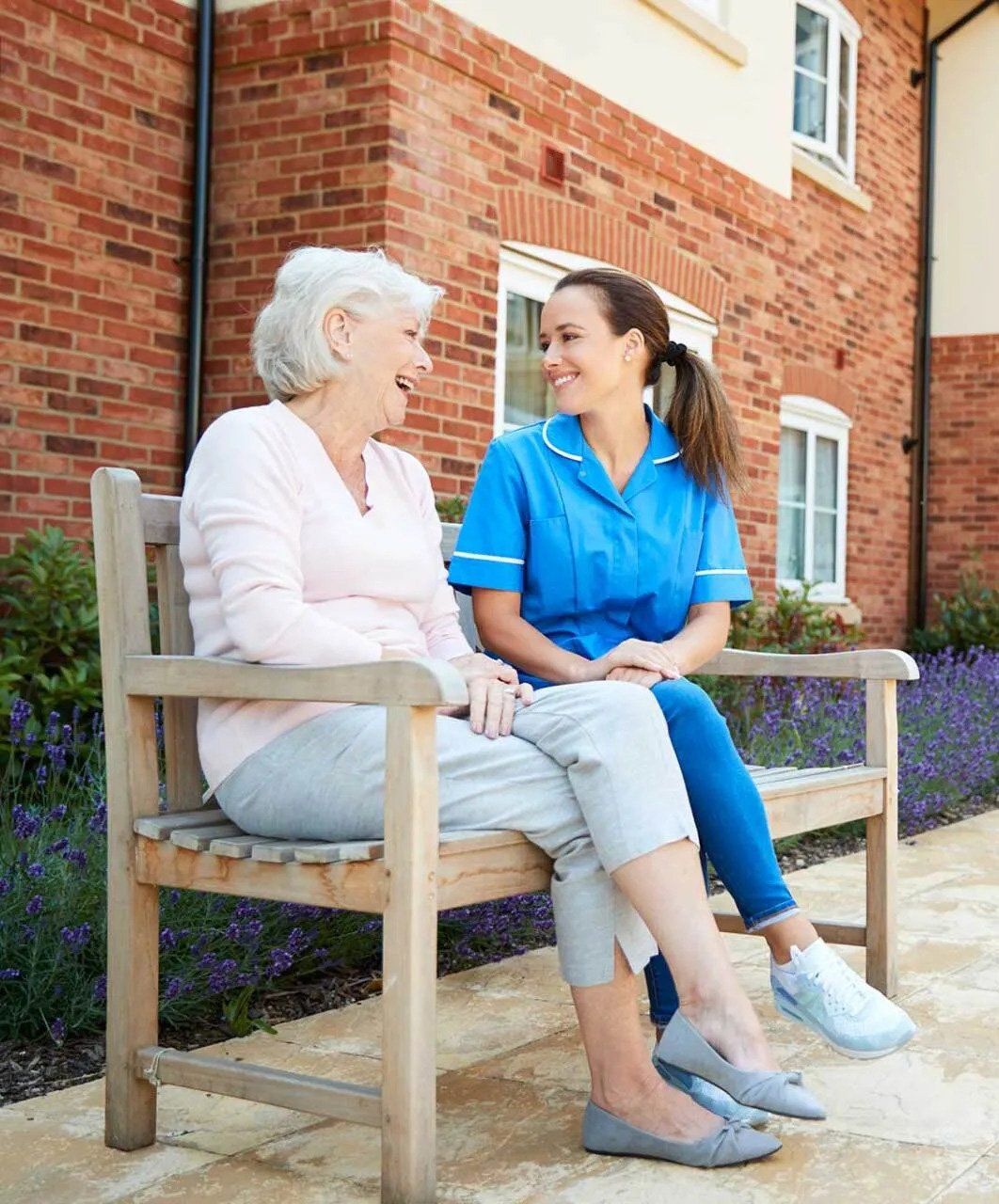 Old Woman and Nurse Sitting on Bench Old Woman and Nurse Sitting on Bench