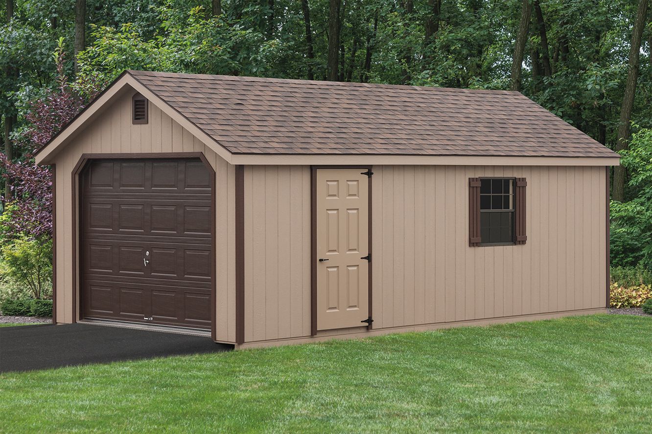 Tan shed with brown roof, door, and garage door on a grassy lawn.