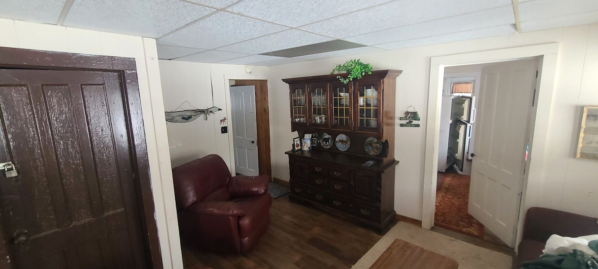 A living room with a couch and a hutch