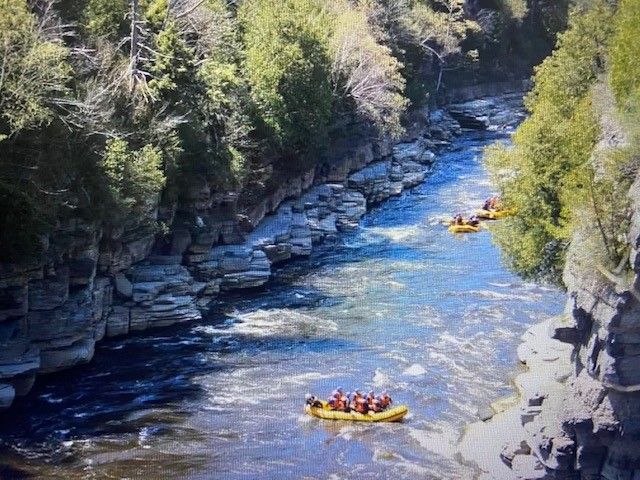 A group of people are rafting down a river.