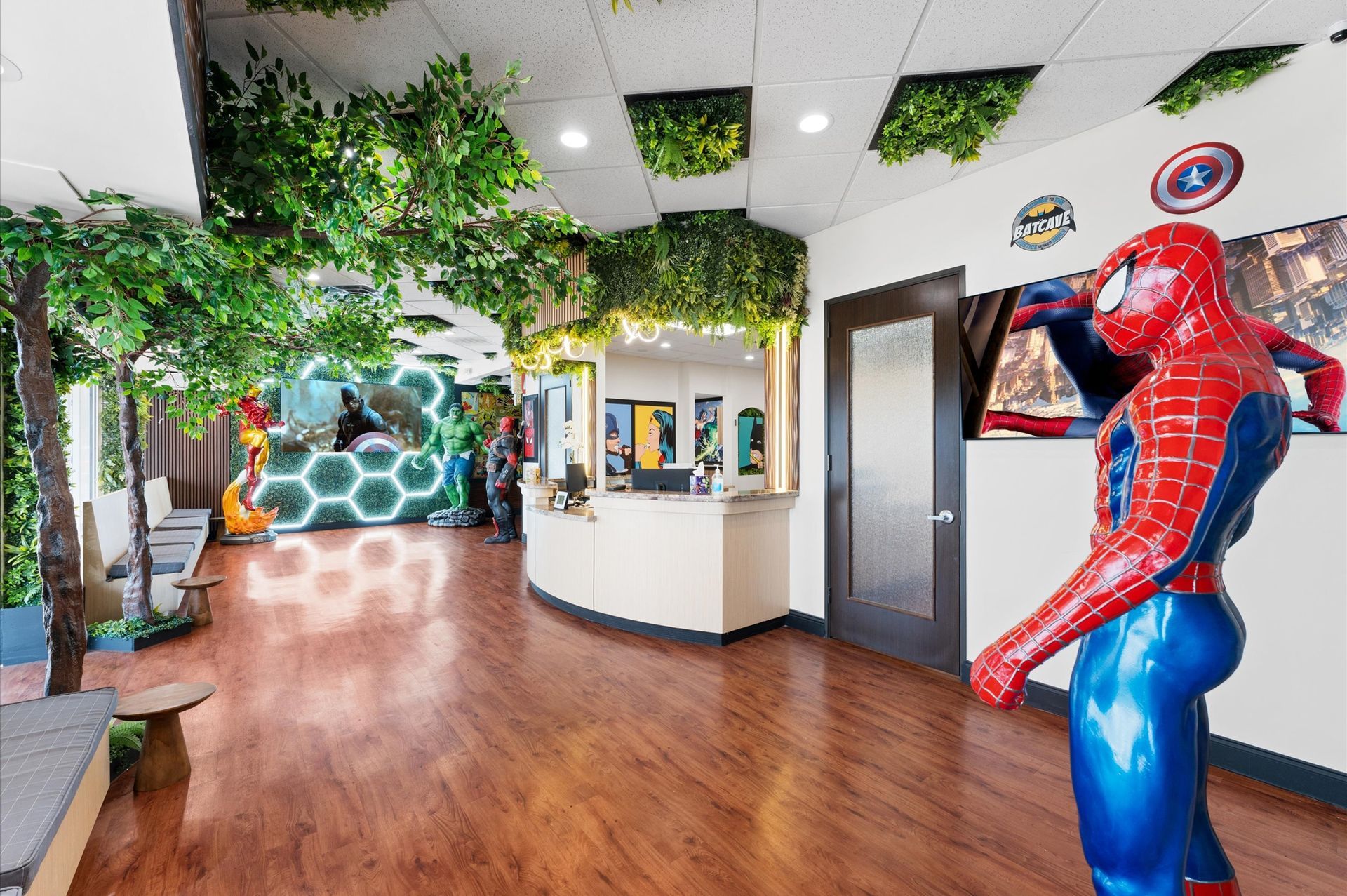 There is a statue of spider-man in the middle of the room.