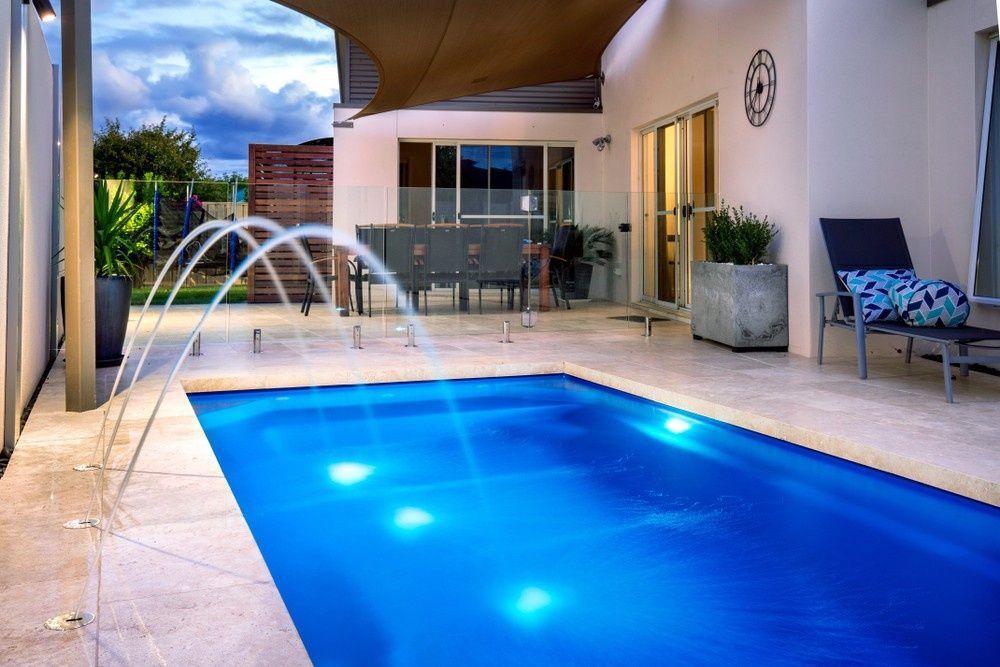 Pool with Fountain Jets and Illuminated Underwater Lights — Ultra Clear Pool Care in Cranbrook, QLD