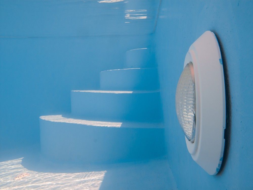 Underwater View of A Blue Swimming Pool with Steps — Ultra Clear Pool Care in Cranbrook, QLD
