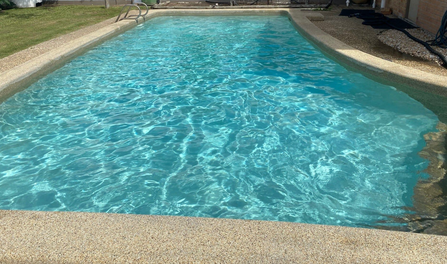 Pool Equipment Room with Blue Filter, Black Pipes, and A Pump — Ultra Clear Pool Care in Cranbrook, QLD