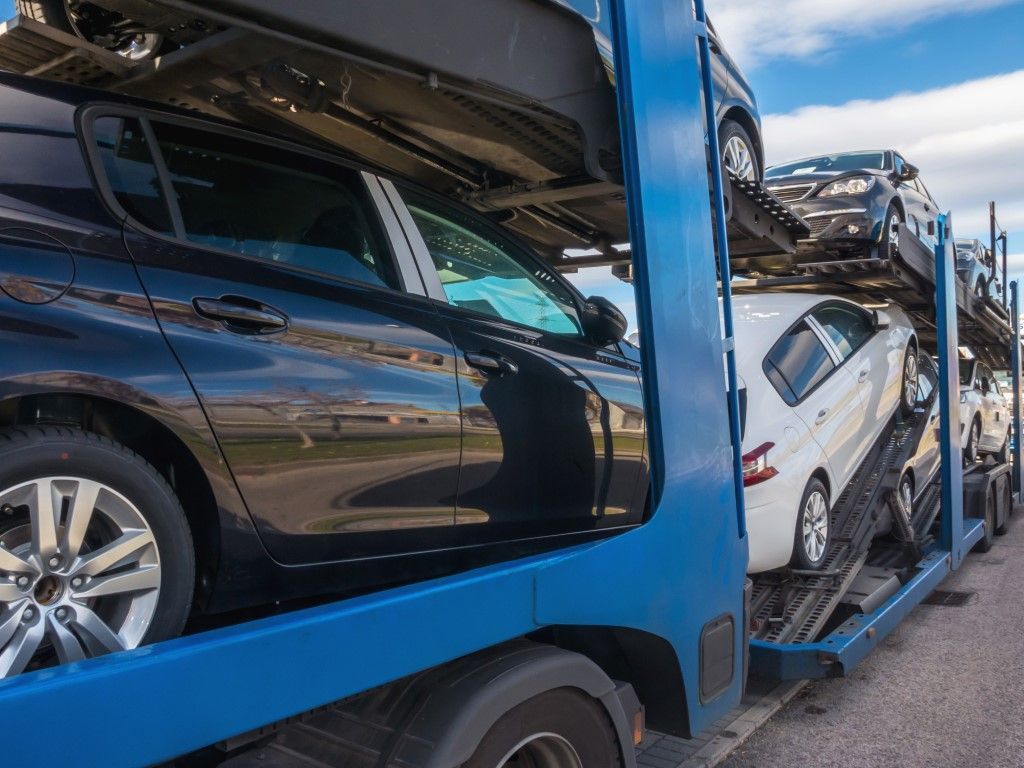 Semi truck transporting premium vehicles.